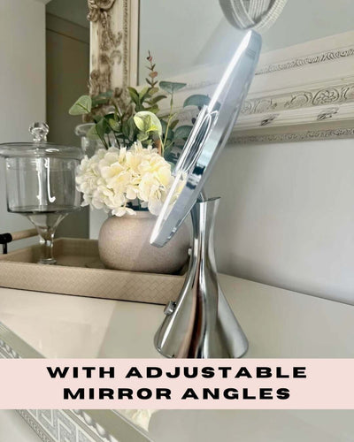 LumiGlam Pro Vanity Mirror in Chrome on a dresser with adjustable angles, featuring LED tones for perfect makeup application.