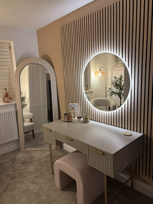 Round backlit wall-mounted mirror with sleek design, touch controls, and adjustable LED lighting, perfect for modern interiors.