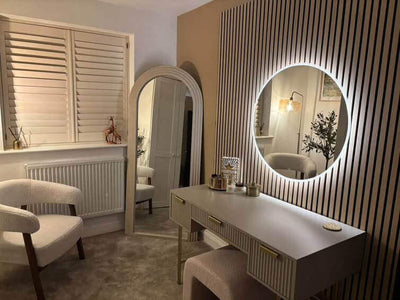 Ava Round Wall Mounted Mirror 80cm in a modern vanity setup with backlighting and stylish decor.