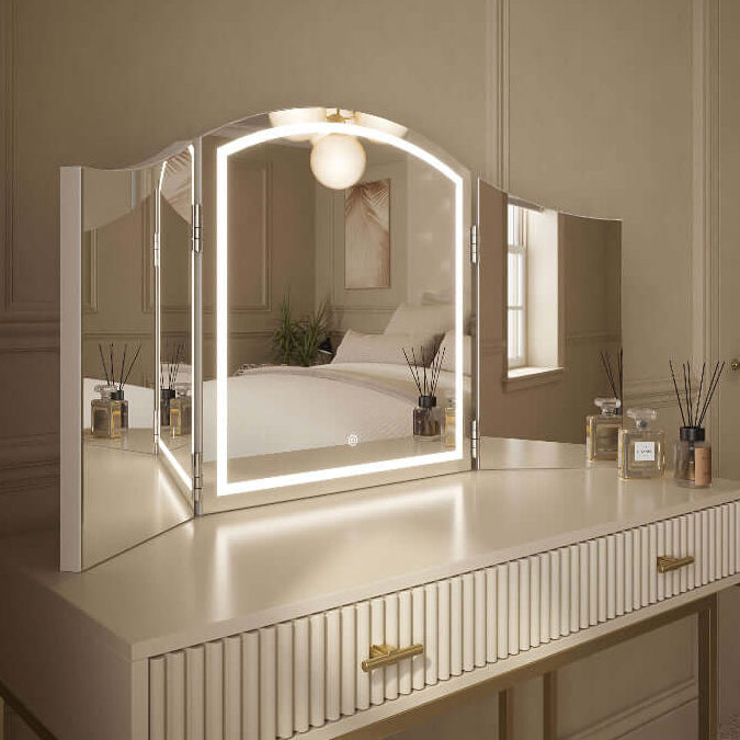Cate Triple Dressing Table Mirror with LED lighting on elegant vanity, showcasing trifold design for flawless visibility and style.