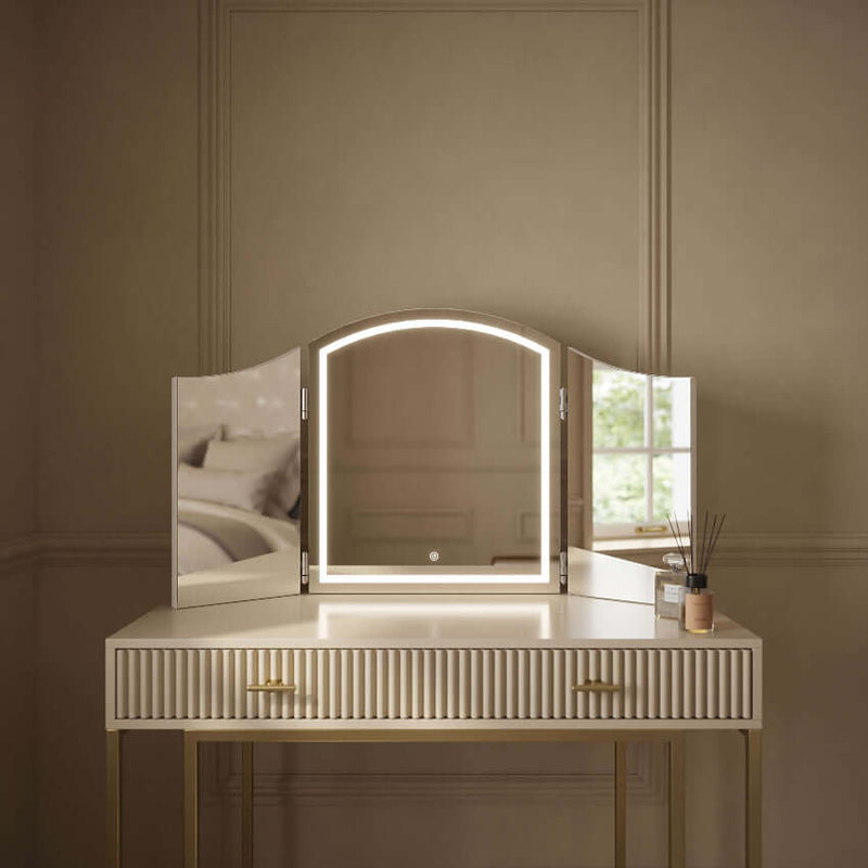 Cate Triple Dressing Table Mirror with LED lighting on elegant vanity, showcasing trifold design for flawless visibility and style.