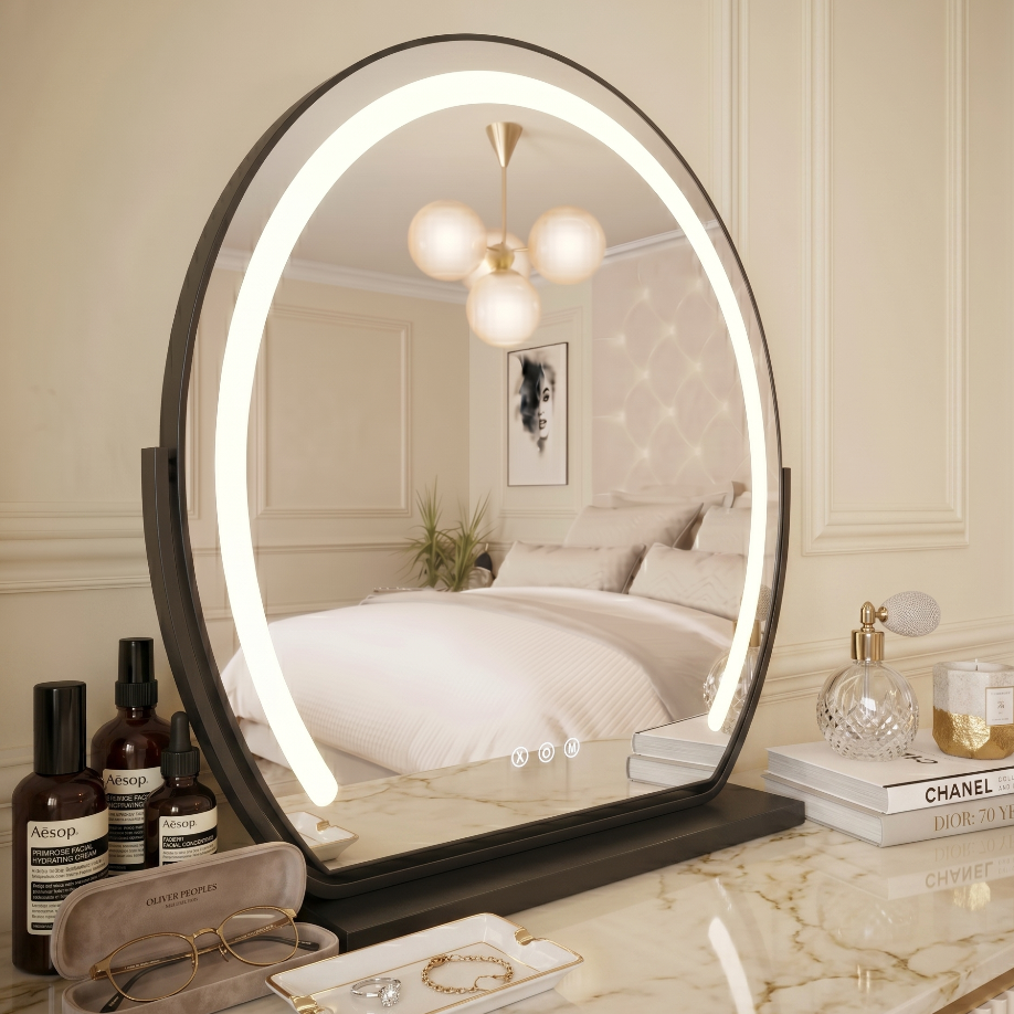 black Round illuminated vanity mirror on a marble countertop with skincare products.