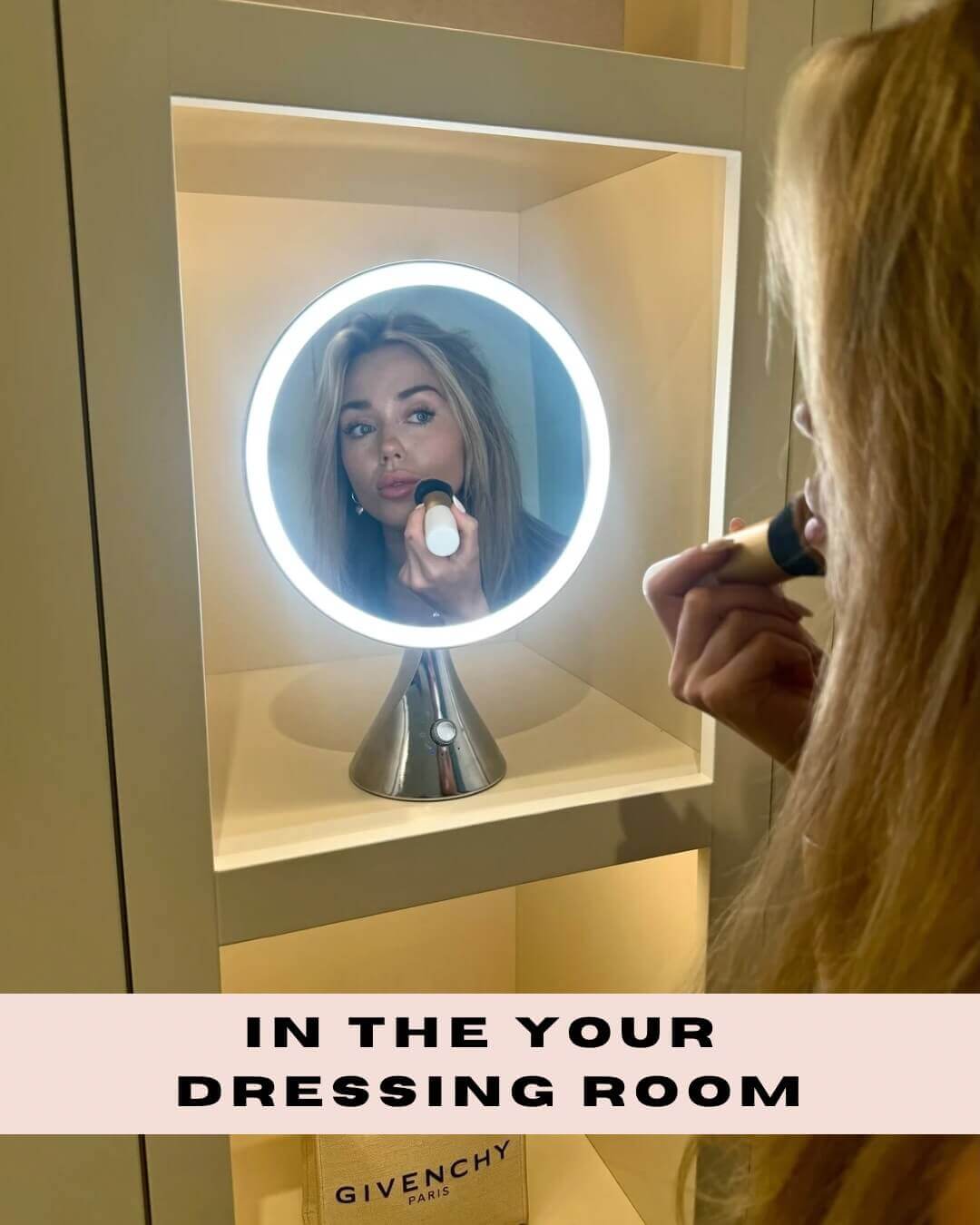 Woman applying makeup with the LumiGlam Pro Vanity Mirror showcasing LED tri-light technology in a dressing room setting.