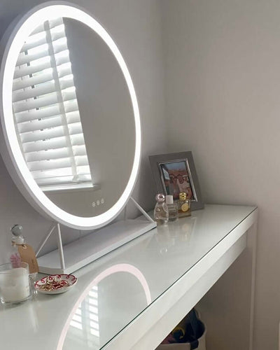 Marilyn Round Hollywood Mirror White 60x63cm displayed on a stylish vanity with ambient lighting.