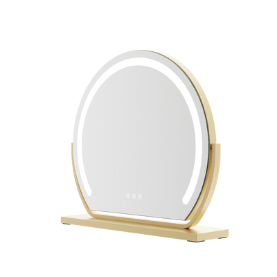 Round makeup mirror with gold frame and wooden base on a white background