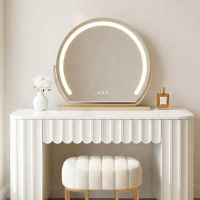 Modern vanity setup with a round illuminated mirror, white console table, and stool against a neutral wall.