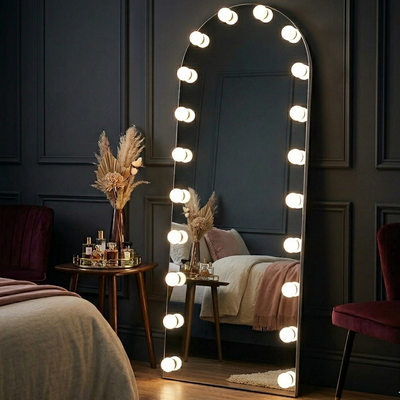 Decorative mirror with lights in a bedroom setting