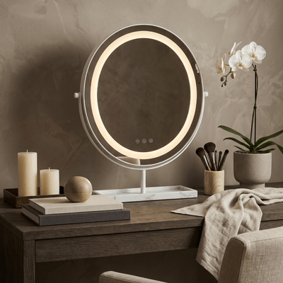 Pre Order Delivery End of April Aurelia LED Vanity Mirror — White & Marble on a stylish desk with candles and brushes.