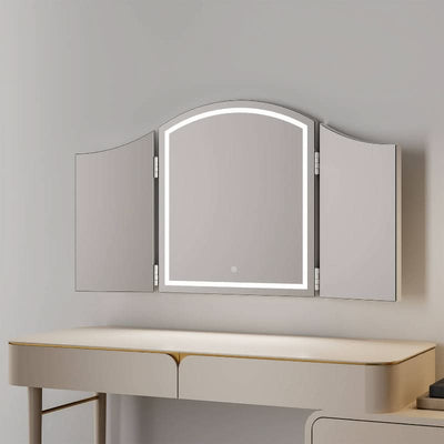 Cate Triple Dressing Table Mirror with LED lighting and trifold design, offering elegant and practical visibility, placed on a chic vanity.