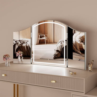 Cate Triple Dressing Table Mirror with LED lighting on a beige dresser, showcasing trifold design for flawless visibility.