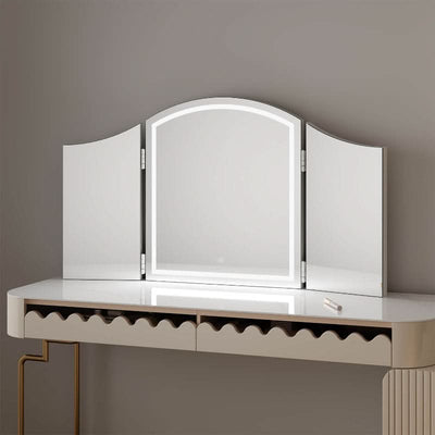 Cate Triple Dressing Table Mirror with LED lighting and curved trifold design, offering elegant and practical visibility for makeup application.