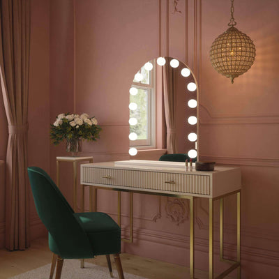 Charlize Arch Hollywood Mirror 80 x 60cm elegantly styled in a chic vanity setup with soft lighting.