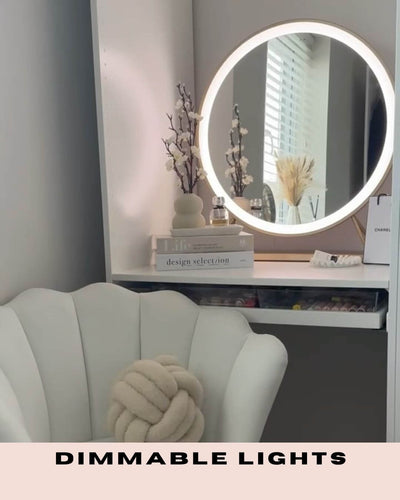 Stylish vanity area with Anne Round Hollywood Mirror featuring dimmable lights, enhancing a luxurious gold frame design.