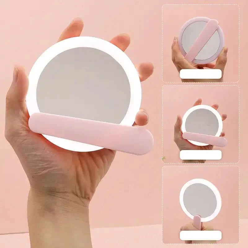 Hand held flip mirror with light pink frame and LED lights, shown in hand and folded, perfect for travel and touch-ups on the go.