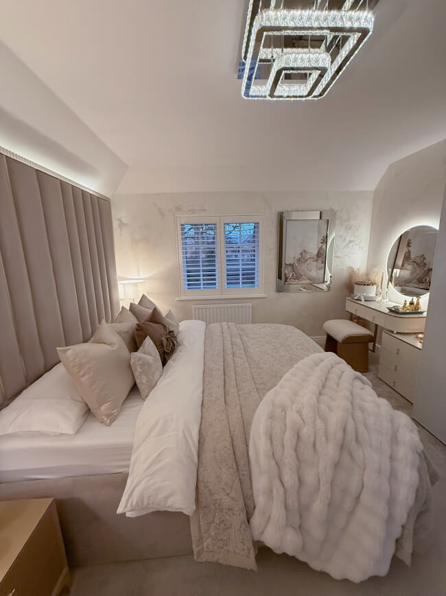 Ava Round Wall Mounted Mirror 80cm above a stylish bed in a modern bedroom design with soft lighting.