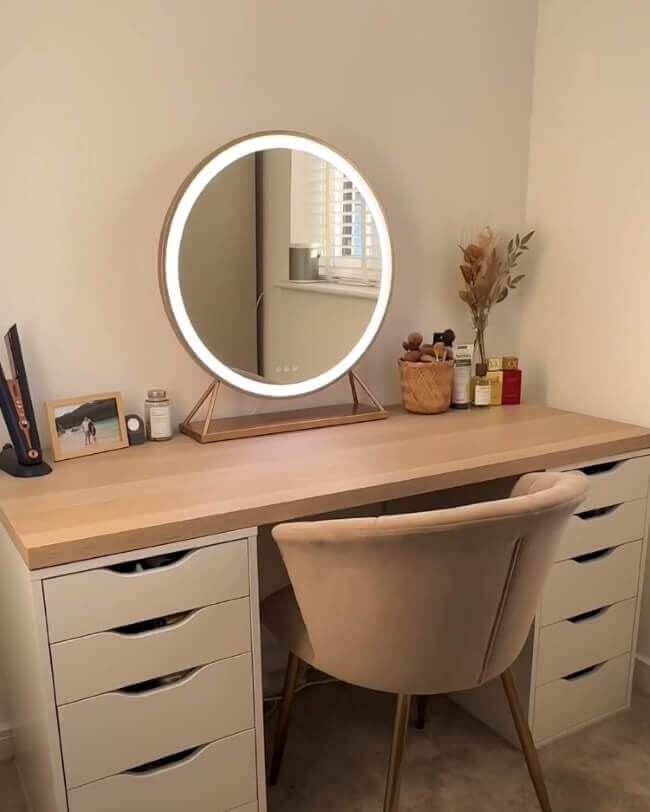 Anne Round Hollywood Mirror with Gold Frame on a stylish vanity table in a modern dressing room with customizable LED lighting.
