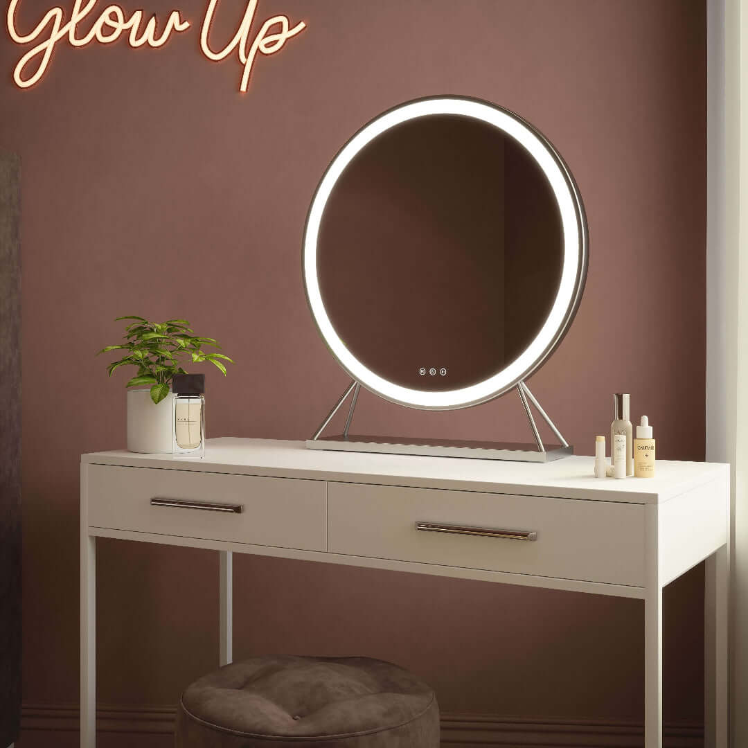 Luxurious silver frame Hollywood mirror with customizable LED lighting on a white vanity table.