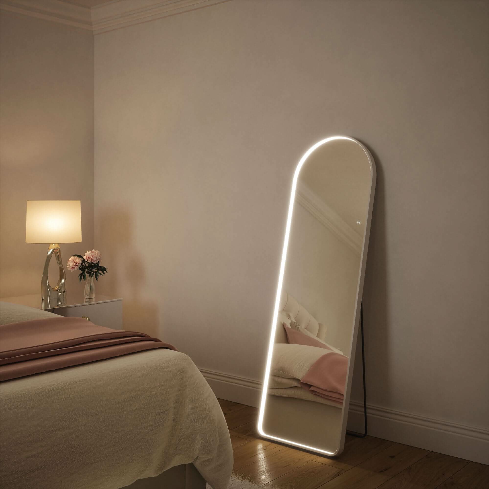 Sophia Full Length Arch Mirror White Frame in bedroom with LED glow, showcasing touch-activated lighting features for style and elegance.
