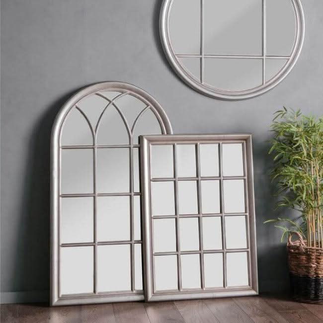 Antique silver window style mirrors with decorative frames displayed in a living room setting to add light and depth.