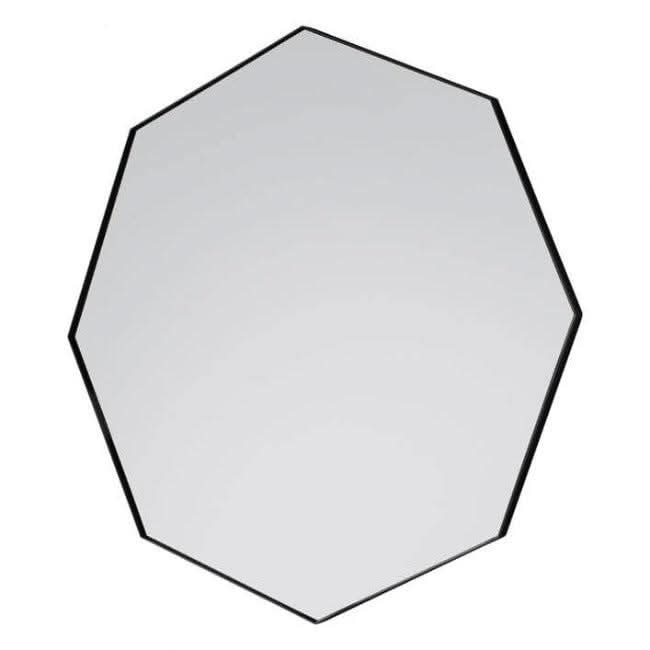 Black Octagon Bowie Mirror with sleek angled frame and silver surround, hanging on a wall near a window, reflecting modern style.