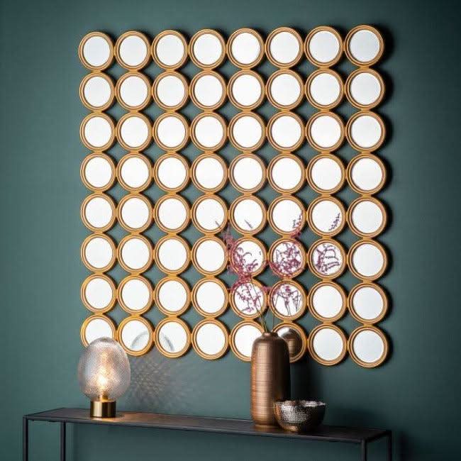 Carrington Small Circles Mirror with 64 gold-framed segments, perfect for modern elegance and glamour in any space. Delivery in 7-10 days.