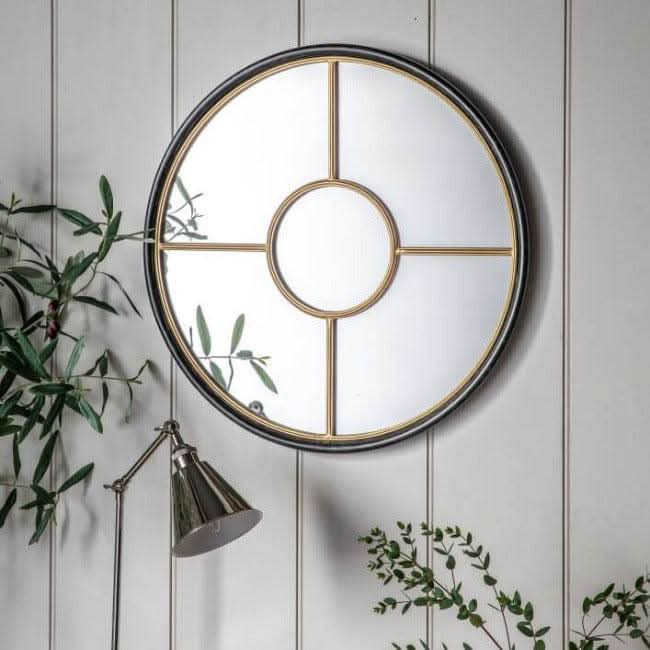 Coco Black & Gold Large Round Window Mirror with industrial design, 800mm wide, features black and gold framing against a white wall.
