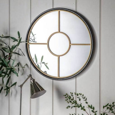 Coco Black & Gold Large Round Window Mirror with industrial design, 800mm wide, features black and gold framing against a white wall.