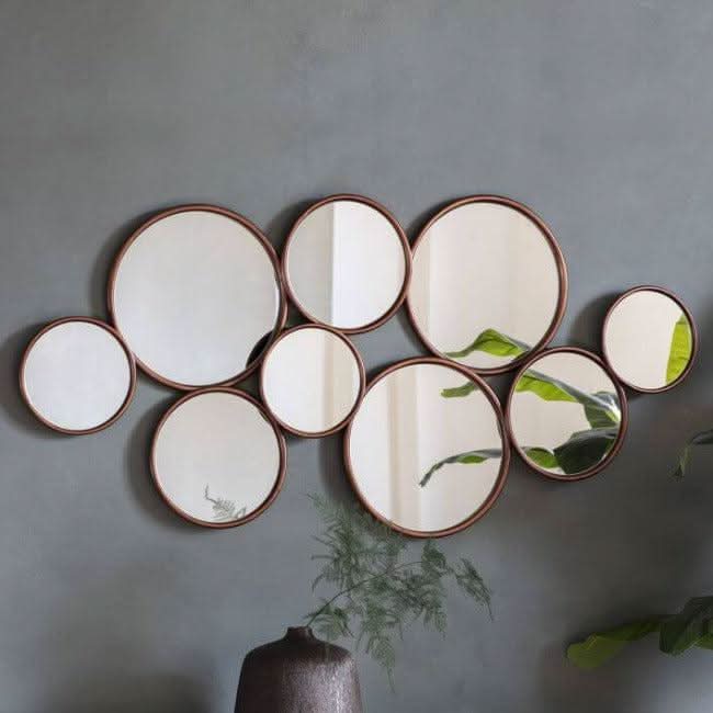 Kempsford round mirror with multiple circles, modern design for hallways and lounges, measuring 1210x40x585mm, stylish wall decor.