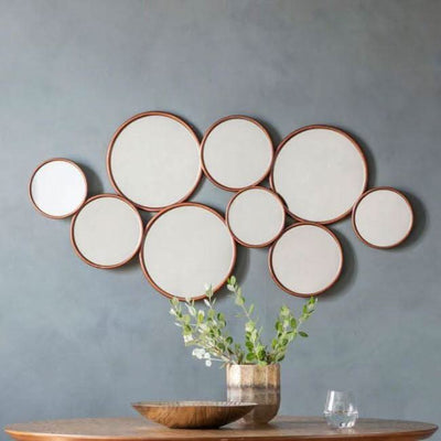 Kempsford round mirror with multiple circles, modern design for hallways and lounges, measuring 1210x40x585mm, stylish wall decor.