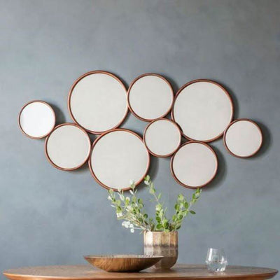 Kempsford round mirror with multiple circles, modern design for hallways and lounges, measuring 1210x40x585mm, stylish wall decor.