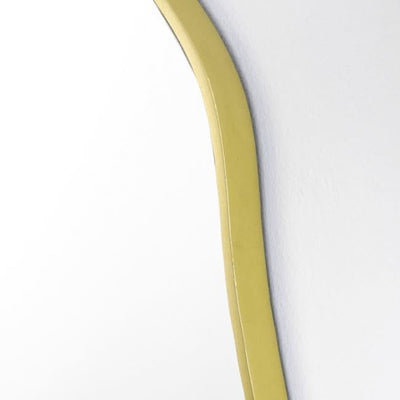 Close-up of a gold metal frame of a large round champagne mirror, highlighting its elegant and modern design.