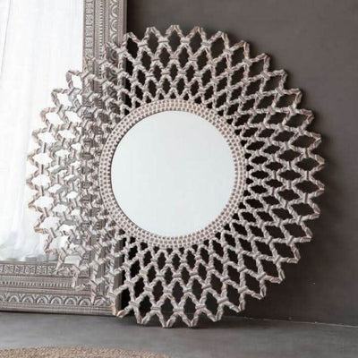 Elegant latticework round mirror with intricate design, serving as a stunning decorative accent piece in home décor.