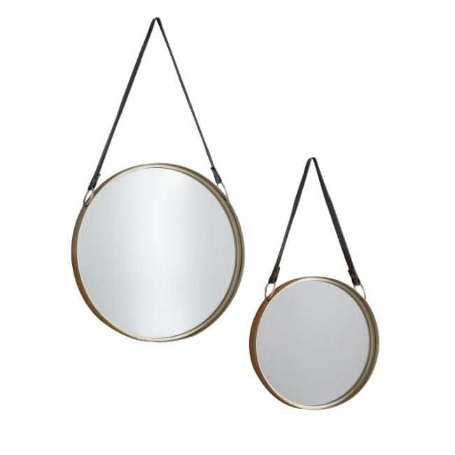 Set of 2 round gold metal framed Marston hanging mirrors with black faux leather straps, perfect for living room or home office decor.