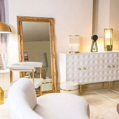 Victoria Gold Baroque Leaner Mirror in elegant room; handcrafted wood frame, adding depth and elegance to bedroom or bathroom decor.