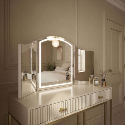 Cate Triple Dressing Table Mirror with LED lighting on elegant vanity, showcasing trifold design for flawless visibility and style.