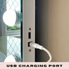 Close-up of a white USB cable plugged into the USB charging port on the side of the Jessica Hollywood Mirror 58cmX46cm with round LED bulbs. USB CHARGING PORT is displayed at the bottom.