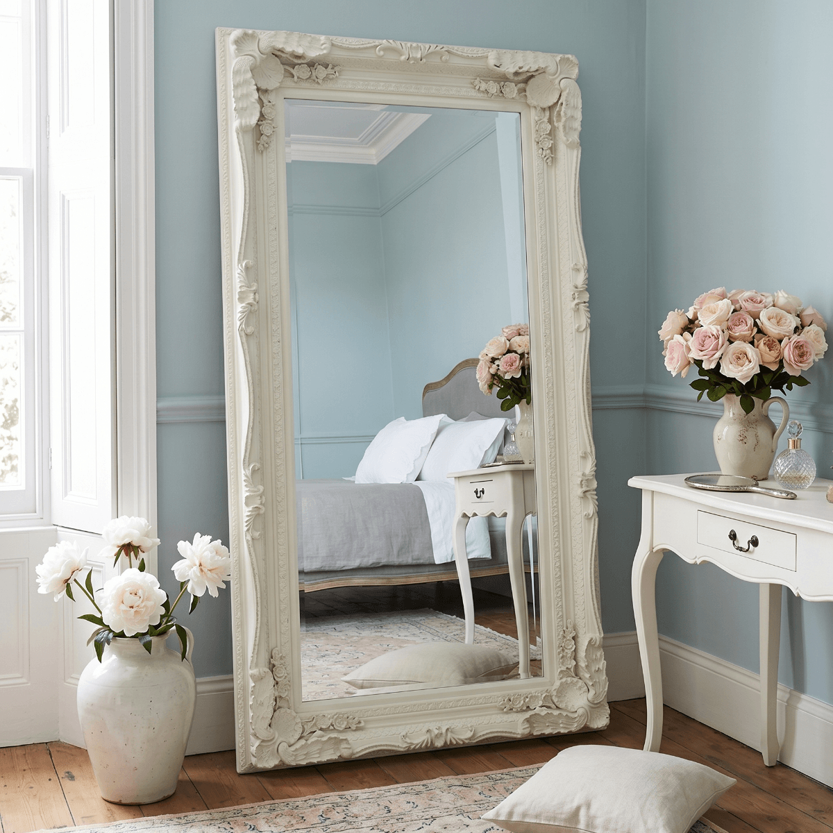 Charles full length cream ornate leaner mirror 176cm x 90cm styled in duck egg blue French bedroom with white peonies and Persian rug — Hollywood Mirrors