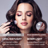 A woman with wavy brown hair appears in front of the Penelope Hollywood Mirror Wall Mounted 80cmx60cm, her face split to show how cool LED lighting on one side looks natural while warm light on the other adds drama, with text describing each effect.