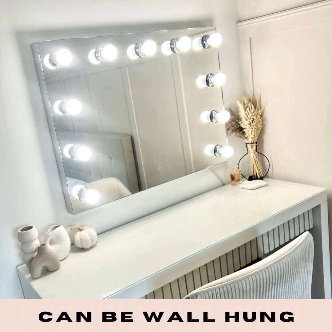 Hepburn Hollywood Mirror with LED lights on white vanity, wall-mounted, showcasing studio lighting, neutral color, chic design.