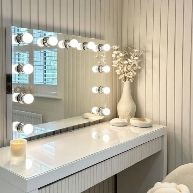 Houston Bluetooth Hollywood Mirror 80x60cm with LED bulbs on vanity, perfect for makeup application, high-quality finish and Bluetooth speakers.