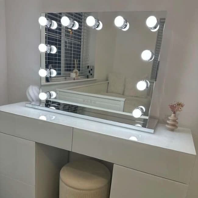 Houston Bluetooth Hollywood Mirror with LED bulbs on white vanity, provides studio-quality lighting for flawless makeup application.