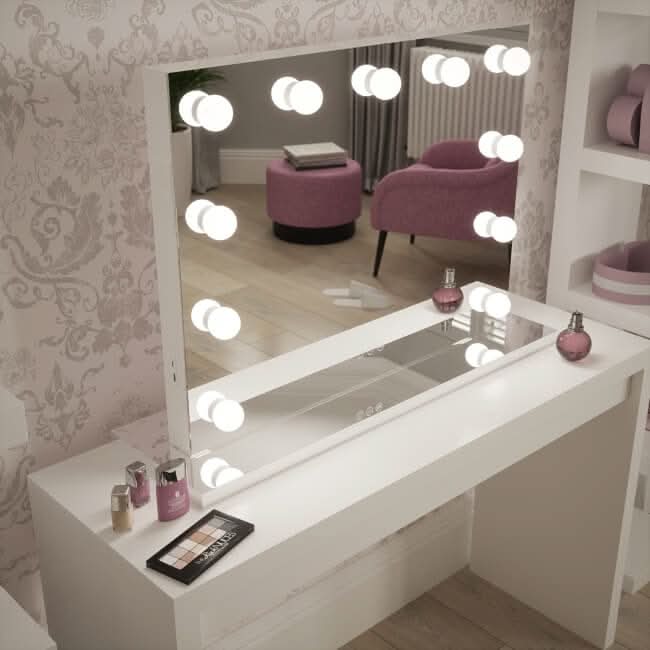 Houston Bluetooth Hollywood Mirror with LED bulbs, providing perfect lighting for makeup application, on a stylish vanity table.
