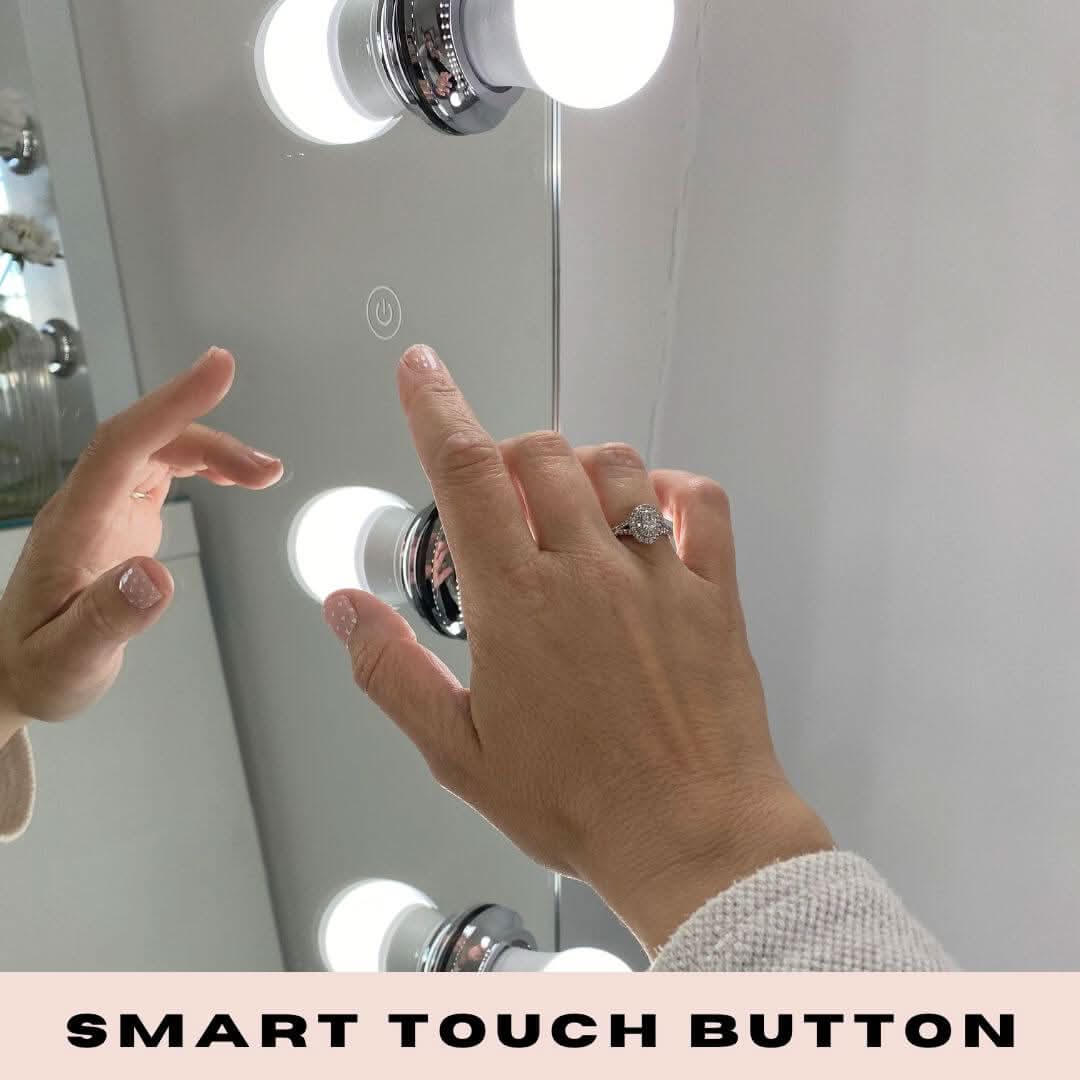 Hand touching smart button on Keira Full Length Hollywood Mirror XXL with bright bulbs.