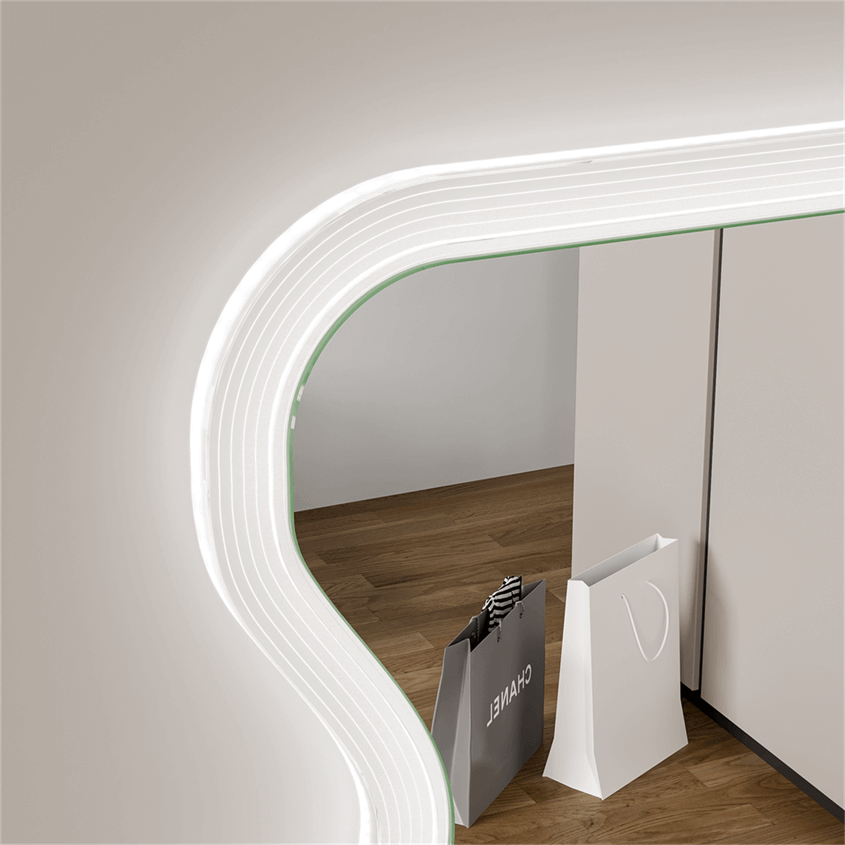 Close-up of Lana Wavy Full Length Mirror with unique wavy design and shopping bags placed on a wooden floor