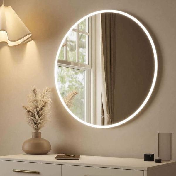 Ava Round Wall Mounted Mirror 80cm displayed on a wall, featuring ambient backlighting and a sleek design.