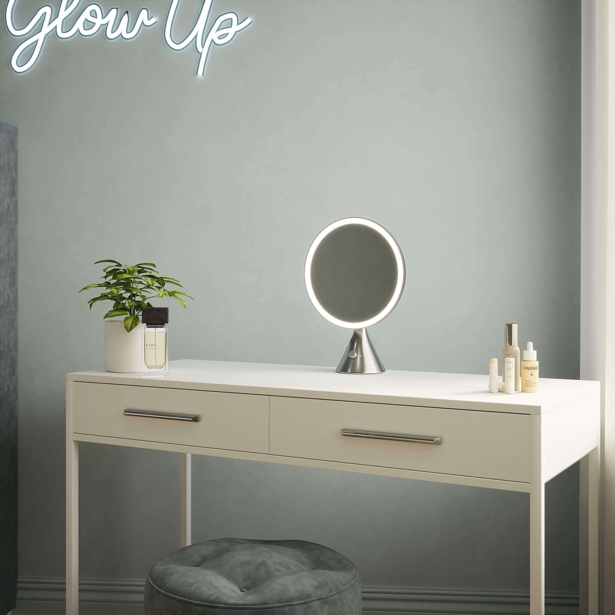 LumiGlam Pro Cosmetic Vanity Mirror in chrome on desk with LED lighting, perfect for makeup application and enhancing true colors.