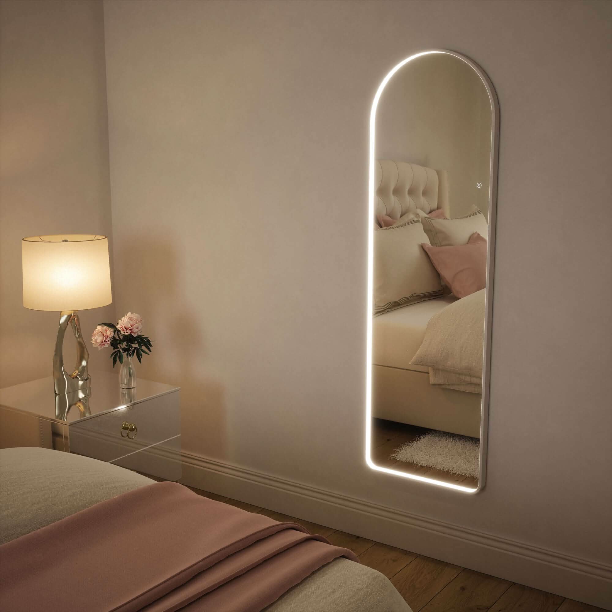 Sophia full-length arch mirror with white frame and LED lighting in bedroom, adding elegant style and illuminated reflection.