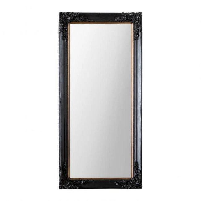 Antique Black Large Harrelson Mirror with baroque mouldings, positioned in a stylish room beside a blue chair and decorative wall.