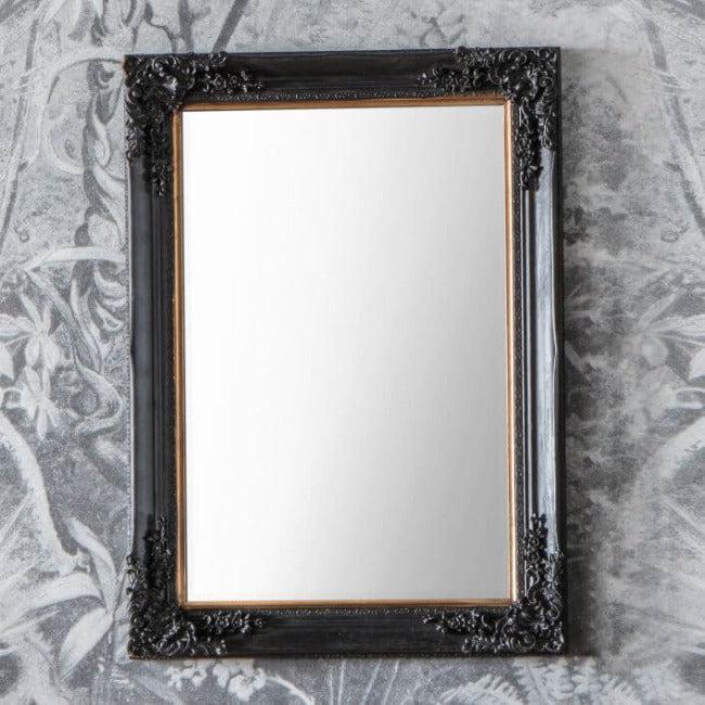 Antique Black Small Harrelson Mirror with Baroque Mouldings on Floral Patterned Wall