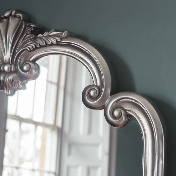 Close-up of elegant silver leaf trim on the Ballagio Overmantle Mirror, showcasing ornate detailing and aged charm.